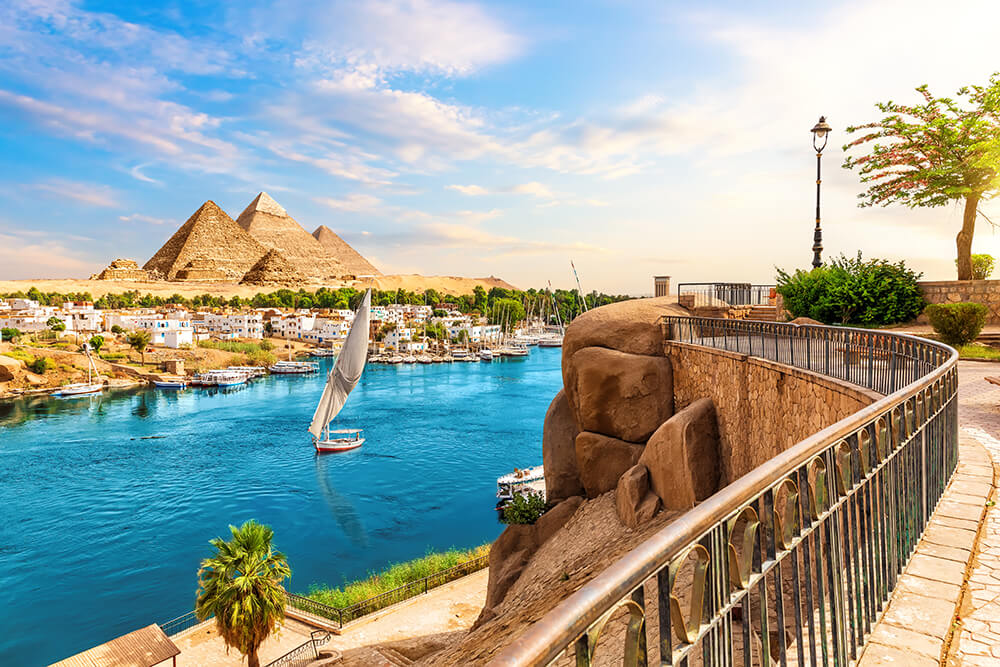 skyline-view-aswan-with-sailboats-nile-way-pyramids-egypt